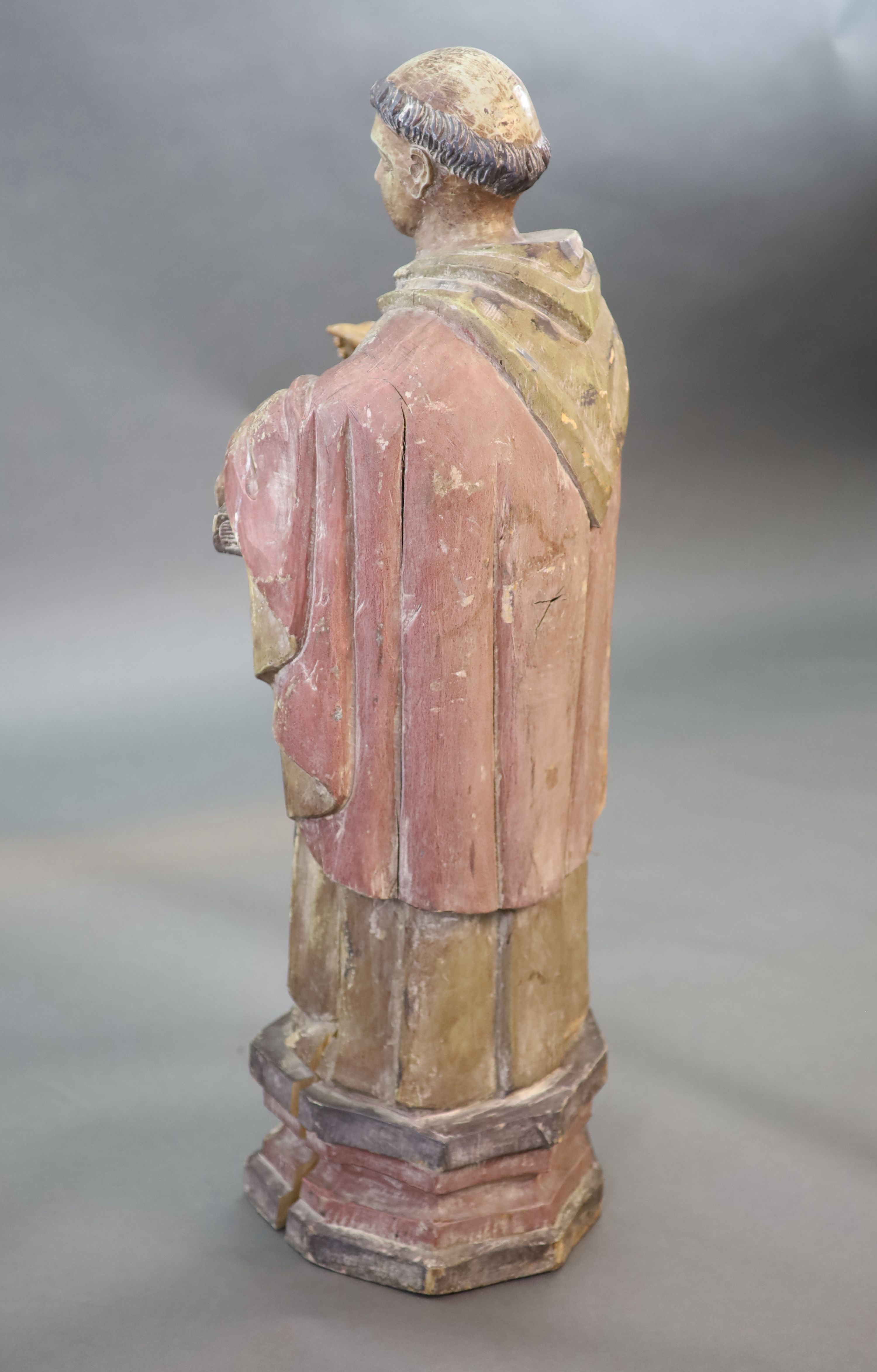 A large carved hardwood study of a standing monk or Saint, early 20th century 102cm high